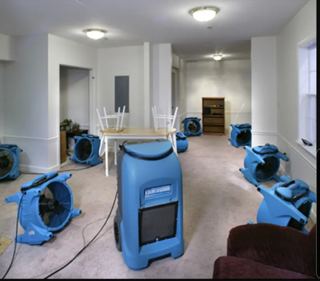 Air movers and dehumidifier setup for Water Damage Restoration in Elbridge